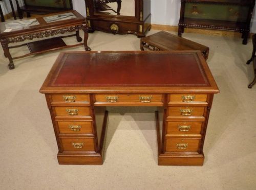 A Mahogany Late Victorian Period Antique Pedestal Desk by Hindley & Sons of London.