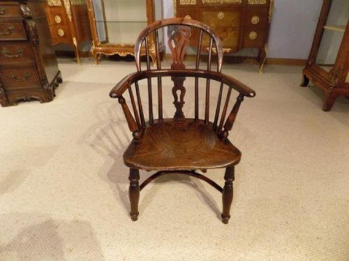 A Rare Yew Wood 19th Century Child's Windsor Armchair.