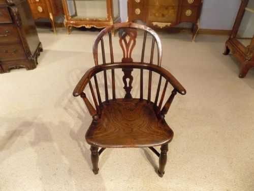 fig 1. A rare yew wood 19th Century child's windsor armchair.