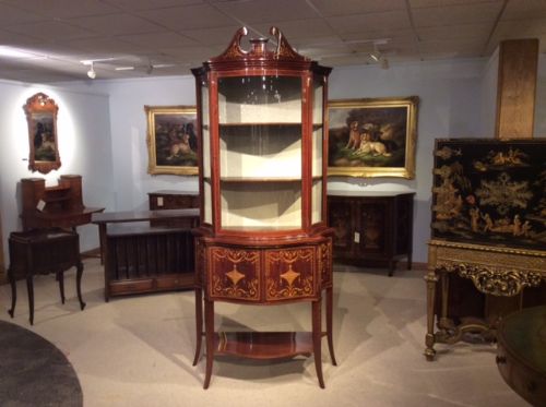 A Fine Quality Marquetry Inlaid Edwardian Period Serpentine Cabinet by Maple & Co of London.