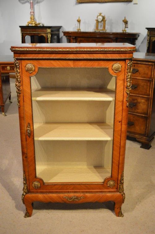 fig 1. A French 19th Century Period Kingwood and ormolu mounted pier cabinet.