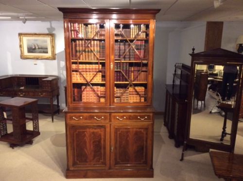 A Fine Quality Flame Mahogany and Inlaid Edwardian Period Antique Bookcase.