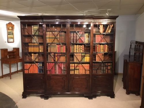 A Mahogany George III Style Breakfront Bookcase.