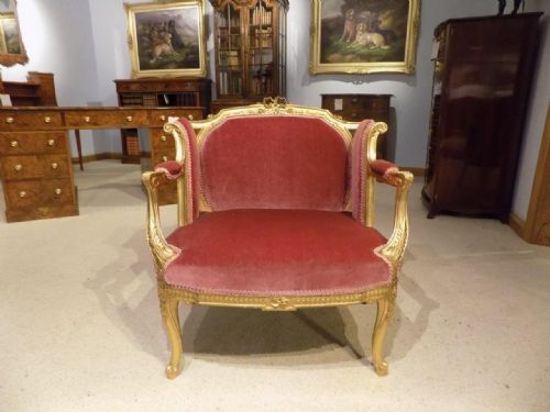 A Carved Gilt Wood Louis Xv Style Armchair.