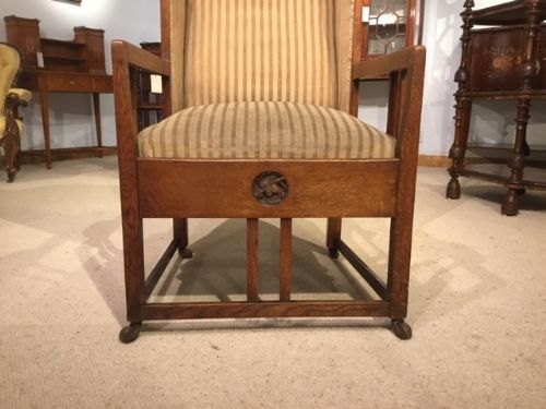 fig 1. An Arts & Crafts Period oak winged armchair possibly by George Montague Ellwood