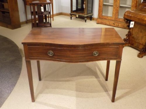 A Mahogany George III Period Serpentine Antique Side Table.