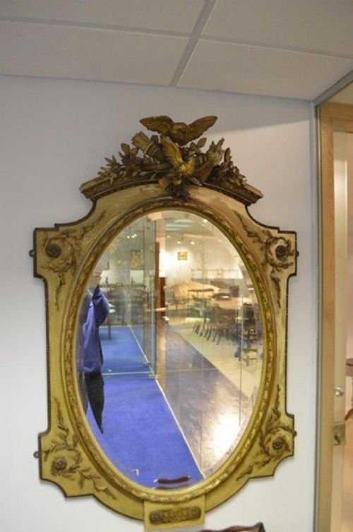 A Carved Gilt Wood French Oval Painted Mirror.