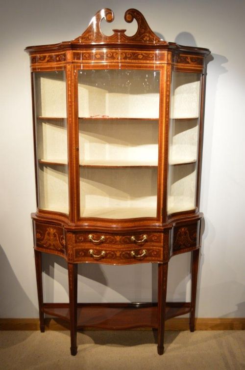 An Exhibition Quality Mahogany Inlaid Serpentine Antique Display Cabinet by Maple & Co of London.