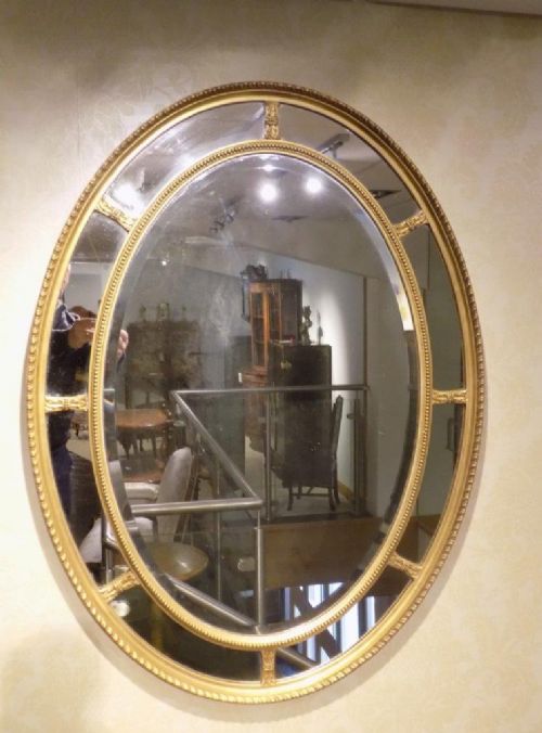 A Gilt George III Style Oval Margin Mirror
