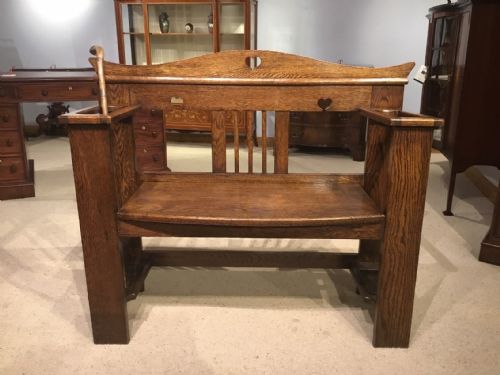 An Oak Arts & Crafts Period Hall Bench/umbrella Stick Stand.
