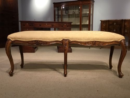 A Good Walnut French Six Leg Stool.