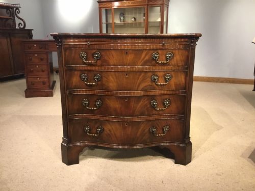 A Superb Quality Chippendale Revival Flame Mahogany Serpentine Bachelors Chest.