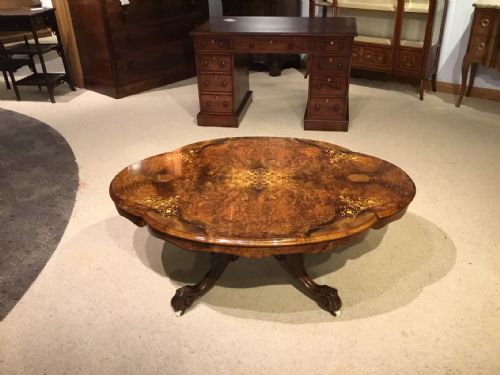 A Victorian Period Burr Walnut Inlaid Shaped Coffee Table.