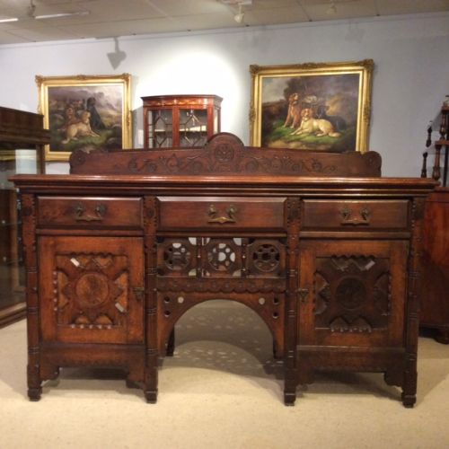A Rare Aesthetic Period Oak Muscular Gothic Sideboard Designed by John Moyr Smith.
