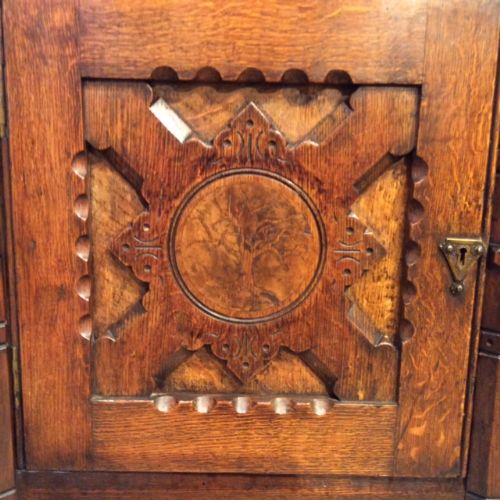 fig 1. A Rare Aesthetic Period oak muscular gothic sideboard designed by John Moyr Smith.