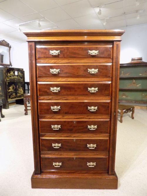 A Victorian Period Mahogany Antique Wellington Chest by Maple & Co of London