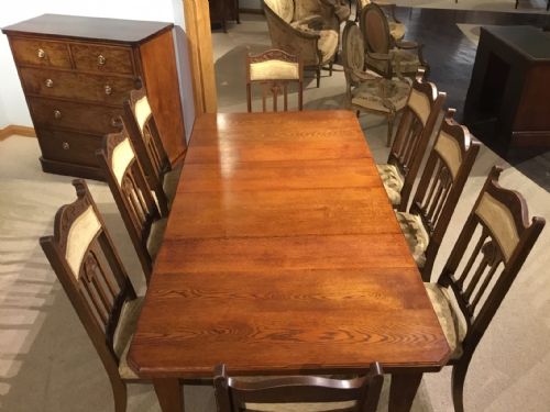 fig 1. An oak Arts & Crafts Period extending dining table and 8 chairs