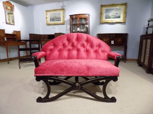 A Victorian Aesthetic Period Ebonised and Gilt Sofa