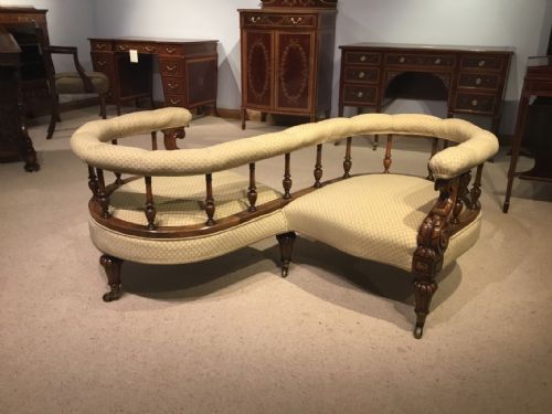 A Carved Walnut Victorian Period Love Seat/conversation Seat.