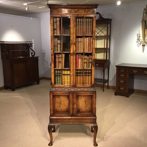 A Walnut George I Style Bookcase by Maple & Co