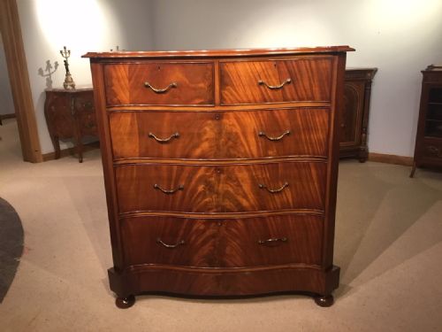 A Flamed Mahogany Edwardian Period Serpentine Chest of Drawers