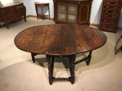 fig 1. An oak Late 17th Century 6-8 seater oval gate leg dining table