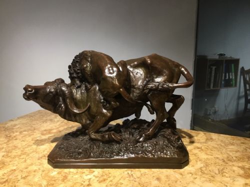 A Large 19th Century French Bronze Animalier Group Depicting a Bull and a Lion