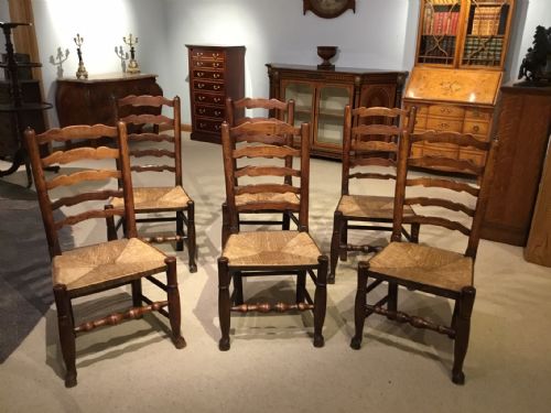 A True Set of Six Ash and Elm 19th Century Ladder Back Rush Seated Dining Chairs