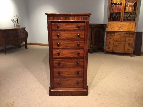 A Figured Mahogany Victorian Period Antique Wellington Chest.