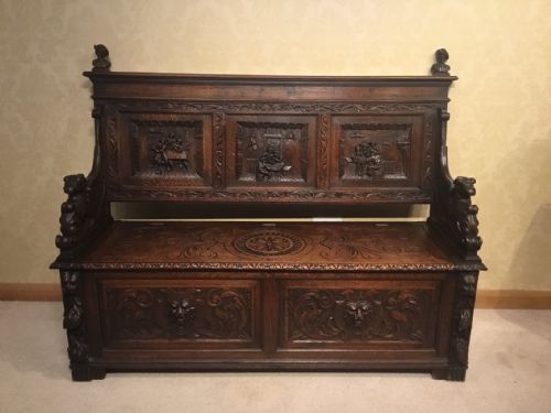 A Victorian Period Oak Carved Hall Bench.