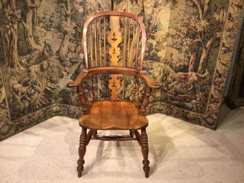 A Mid 19th Century Fruitwood Broad Arm Windsor Armchair