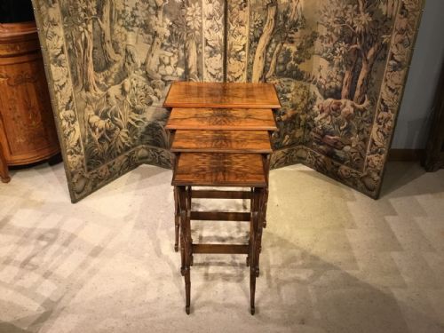 A Fine Quality Walnut Quartetto of Tables