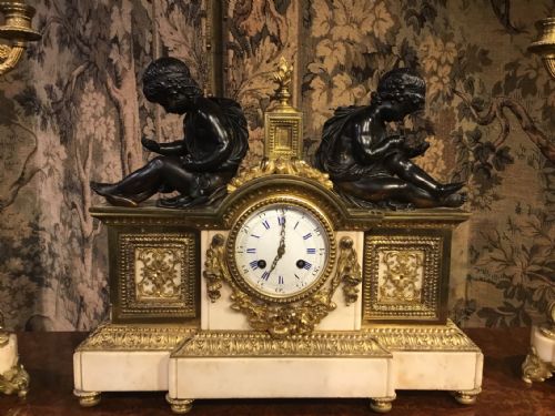 fig 1. A Late 19th Century marble, bronze and Ormolu French clock garniture