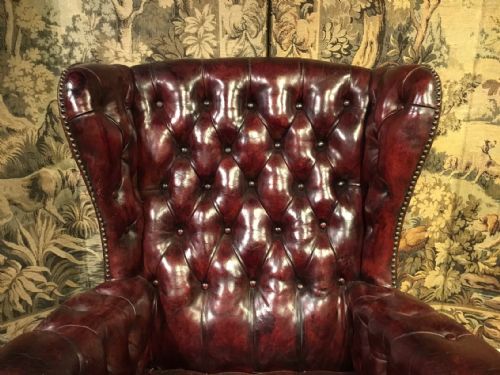 fig 1. A red leather Georgian Style wing armchair