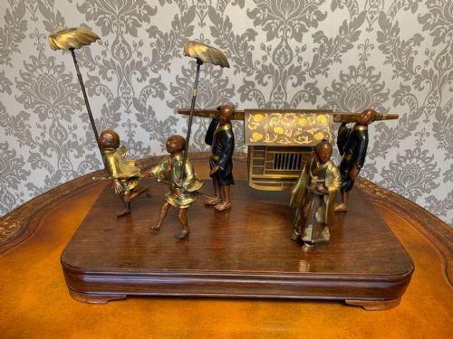 A Japanese Meiji Period Bronze, Gold and Shakudo Inlaid Group