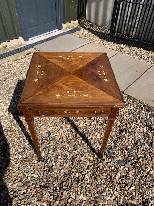 A Victorian Period Rosewood and Marquetry Inlaid Envelope Games Table