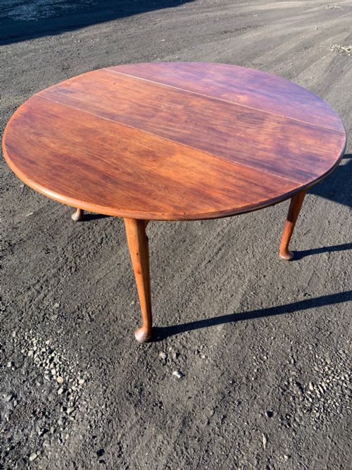 A Georgian Period Cuban Mahogany Drop Leaf Dining Table