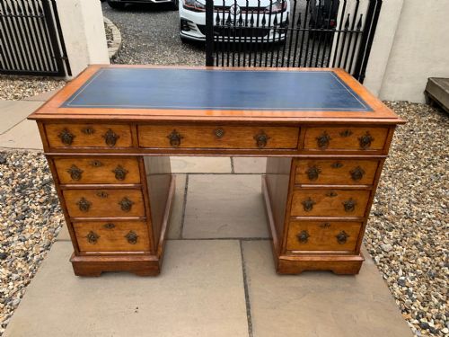 A Victorian Period Gothic Revival Oak Pedestal Desk.