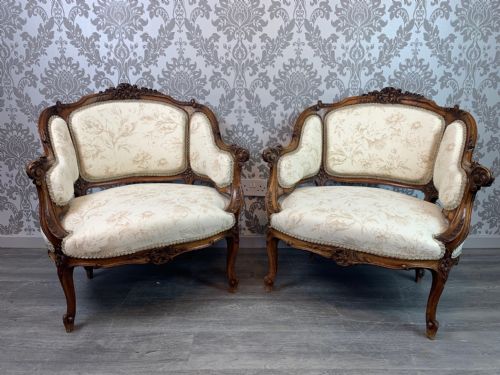 A Superb Pair of French Carved Walnut Armchairs