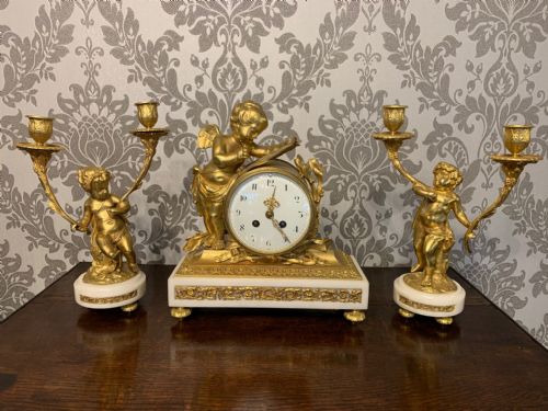 A Fine Quality French Ormolu and Marble Cherub Clock Garniture