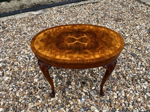 A Small Oval Burr Walnut Queen Anne Revival Coffee Table