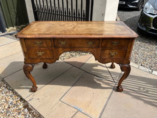 A George I Style Burr Walnut Desk.
