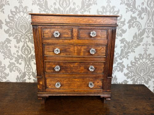 An Early 19th Century Oak Miniature Chest of Drawers Constructed in Oak