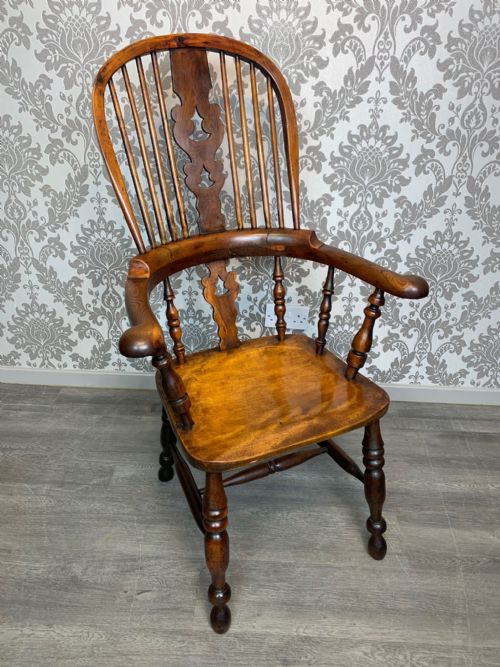 A Mid 19th Century Yew Wood Broad Arm Windsor Arm Chair