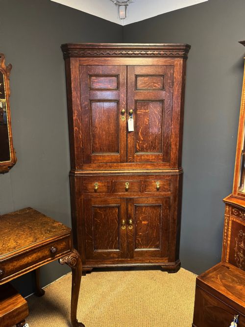 A George III Period Oak Double Corner Cupboard