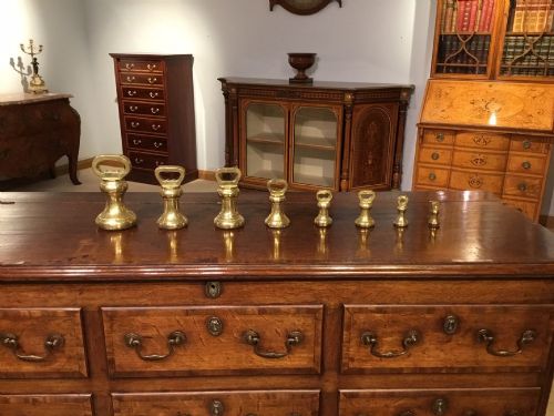 A Set of 8 Victorian Period Antique Brass Weights