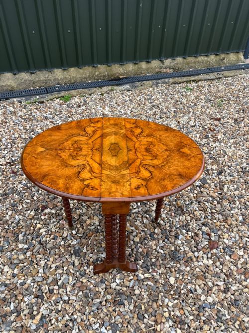A Victorian Period Figured Walnut Baby Sutherland Table