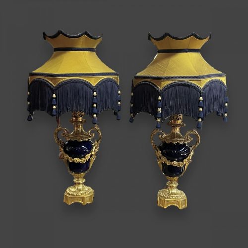 A Large Scale Pair of French Ormolu and Glass Lamps
