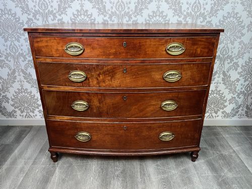 A Regency Period Mahogany Bow Front Chest of Drawers.