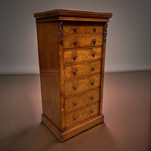 A Mid Victorian Period Pollard Oak Wellington Chest by Edwards & Roberts of London.